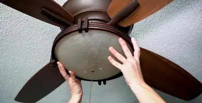 Ceiling fan repair and reinstallation on ceiling mount in Tucson, AZ