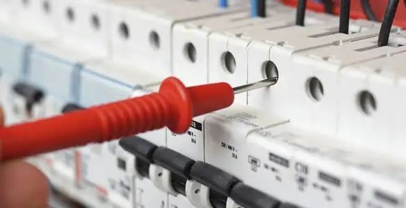 Electrical contractor testing circuit breakers during electrical repair in Sahuarita, AZ