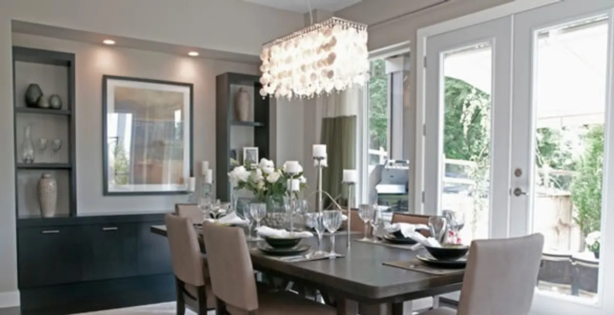 Elegant dining room chandelier installation above table in Tucson, AZ