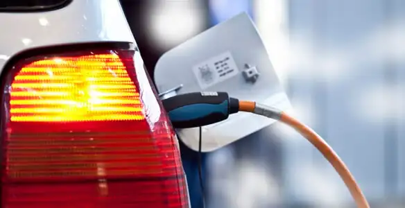 Electric car plugged into EV charger after professional installation in Tucson, AZ
