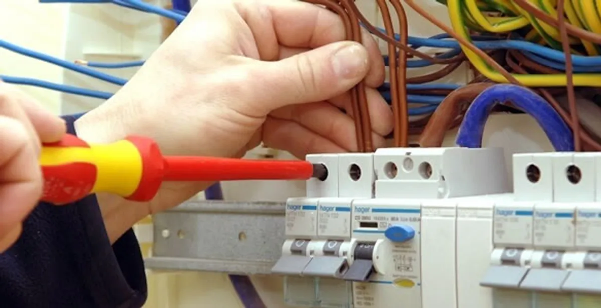 electrician services performing professional electrical panel wiring and connections in Tucson, AZ