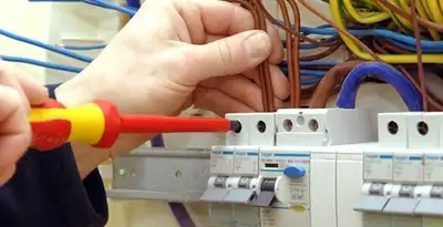electrician services performing professional electrical panel wiring and connections in Tucson, AZ