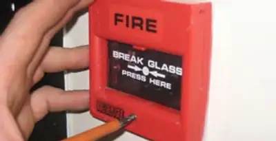 fire alarm installation service showing manual fire alarm pull station installed by licensed electricians in Tucson, AZ
