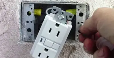 gfci circuits service showing installation of a ground fault circuit interrupter outlet by licensed electricians in Tucson, AZ