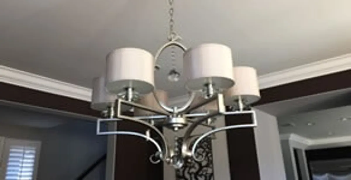 Modern chandelier installation with multiple light fixtures in Tucson, AZ