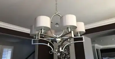 Modern chandelier installation with multiple light fixtures in Tucson, AZ