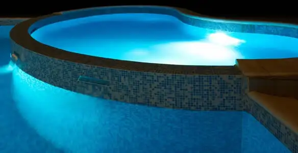 pool light installation and repair services highlighting illuminated pool interior lighting in Tucson, AZ