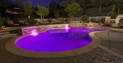 pool light installation and repair services illuminating a residential swimming pool in Tucson, AZ