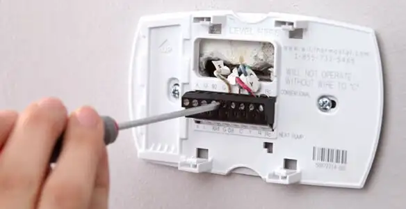 Thermostat installation service with proper wiring and secure wall mounting in Tucson, AZ