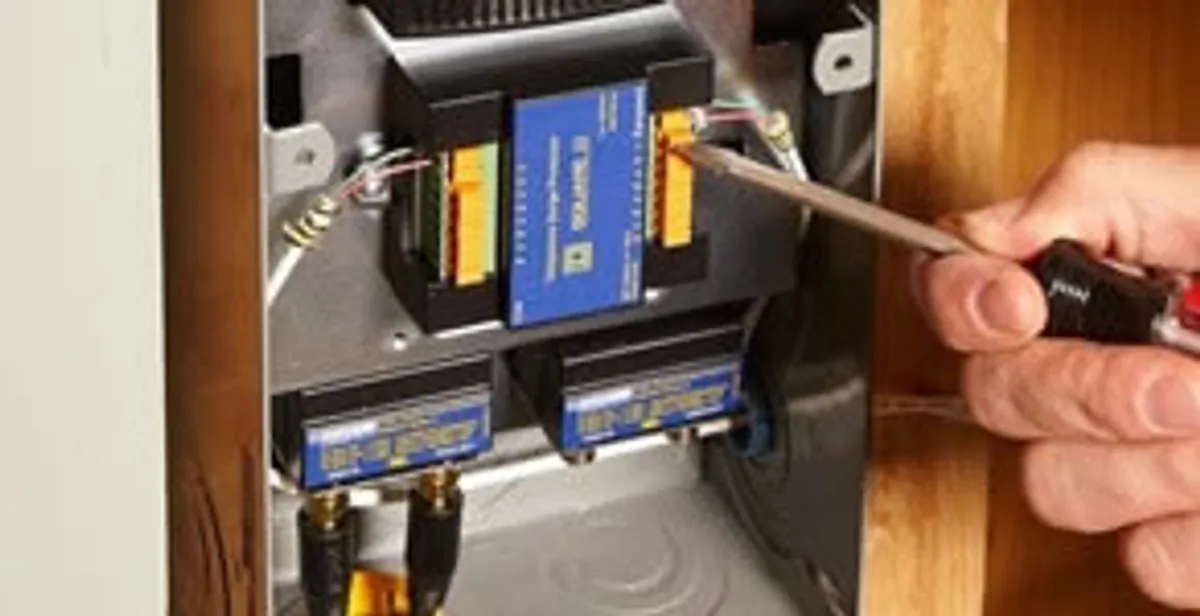 Whole home surge protection device being installed by a licensed electrician to protect electrical systems in Tucson, AZ