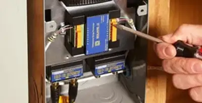 Whole home surge protection device being installed by a licensed electrician to protect electrical systems in Tucson, AZ
